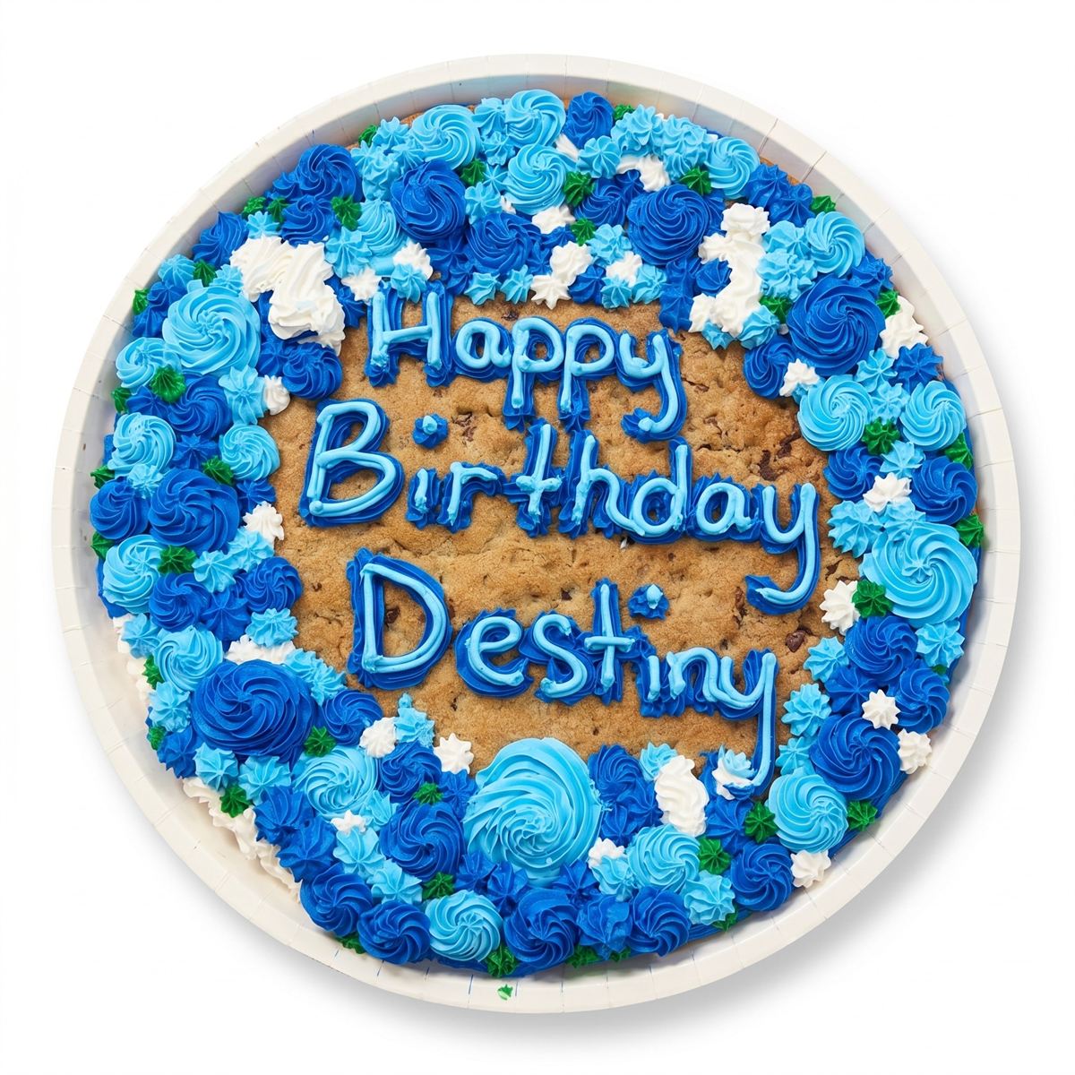 A giant chocolate-chip cookie cake bordered with blue and white buttercream rosettes, lettered Happy Birthday Destiny.